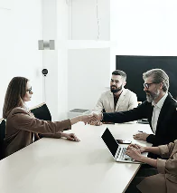 A diverse group of people seated around a table
