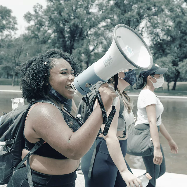 A woman holding a megaphone