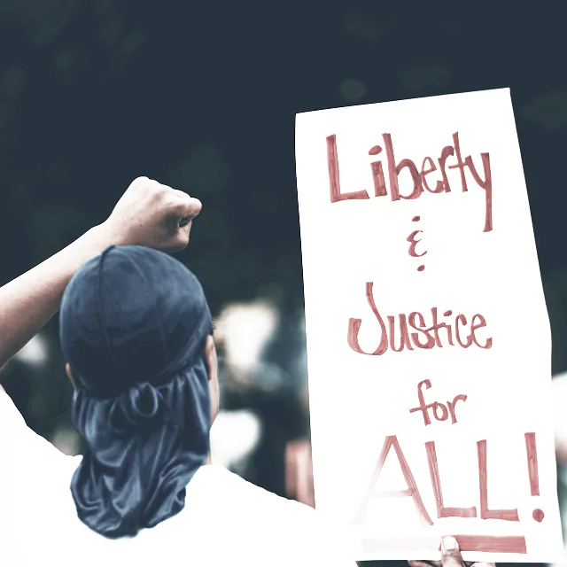 A bold graphic featuring the phrase "Liberty and Justice for All"