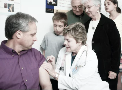 A doctor carefully examines a patient's arm